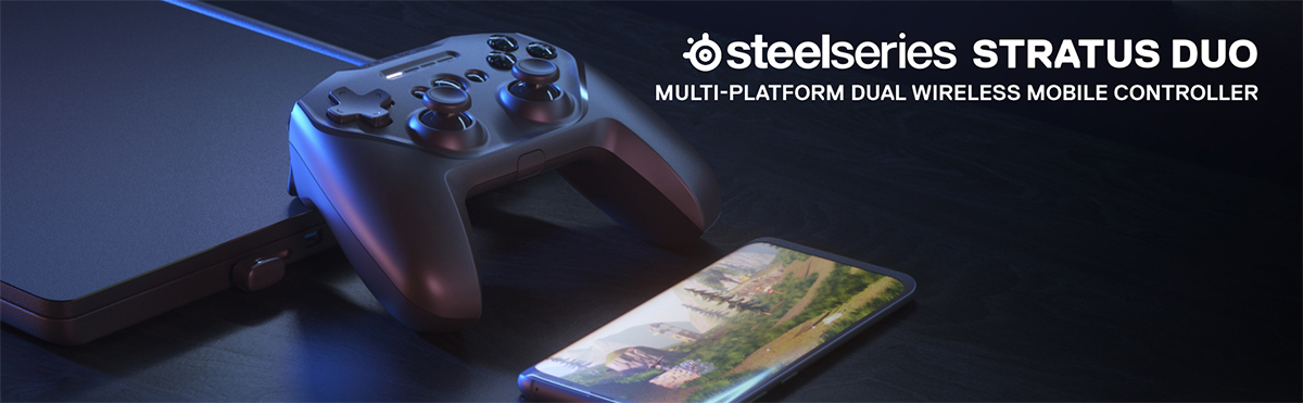 SteelSeries Stratus Duo Stratus Duo ved siden av en mobil og en bærbar datamaskin
