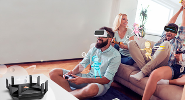 Archer AX6000 kan kobles til mange enheter En gruppe venner sitter med VR-briller på og router i forgrunnen