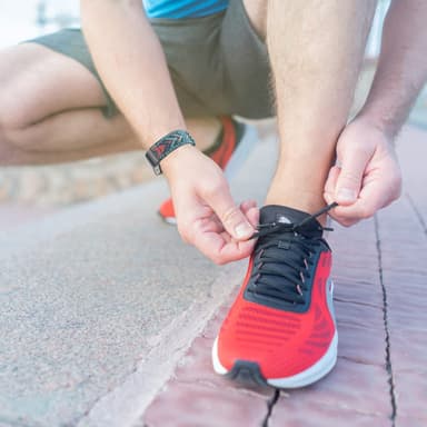 Fitbit Charge 5 klokkerem med flettemønster Blå/oransje