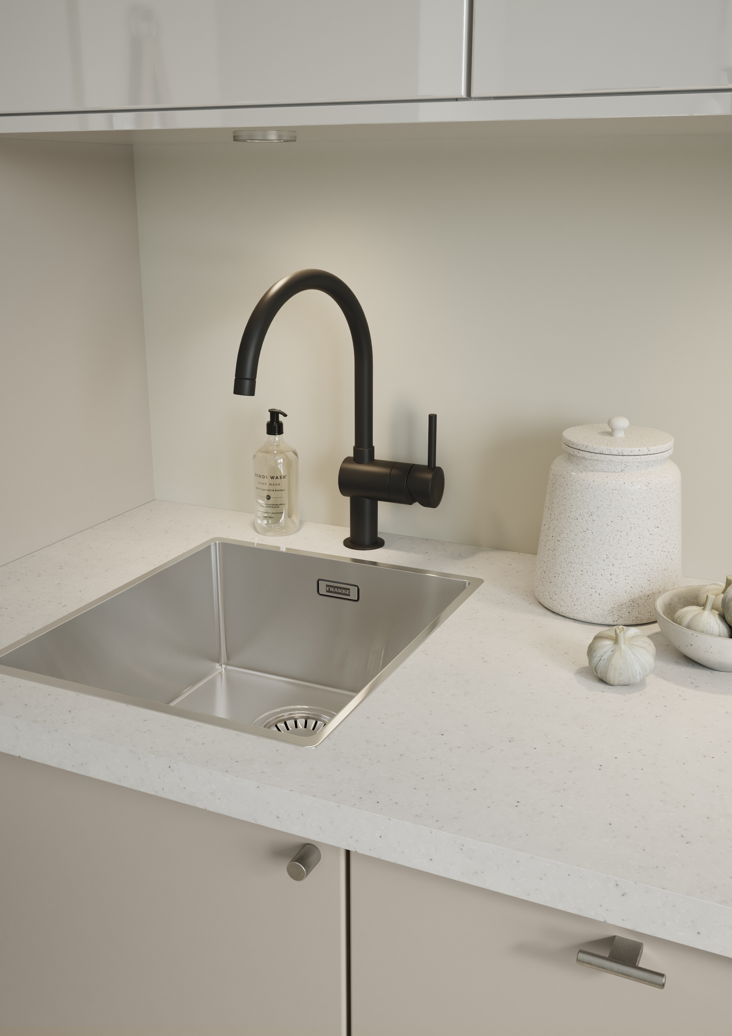 Kitchen area in an Epoq Trend Greige kitchen with light beige fronts and white laminate worktop