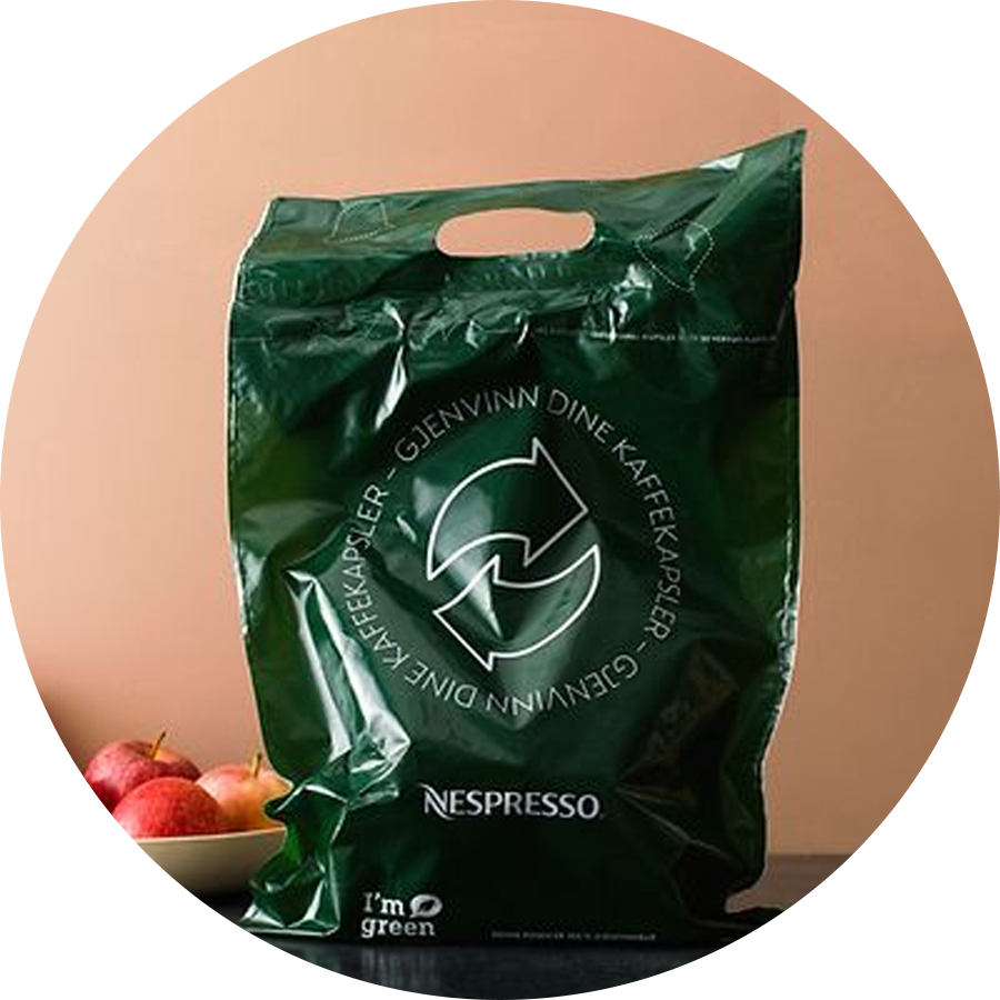 Grønn Nespresso-plastikkpose
