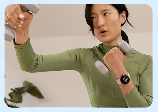 Woman working out with Pixel Watch 2 on her arm