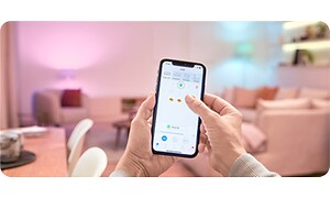 WiZ app på smarttelefon for justering av belysning og lystemperatur