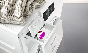 detaljbilde av Miele oppvaskmaskin med åpen CapDosing