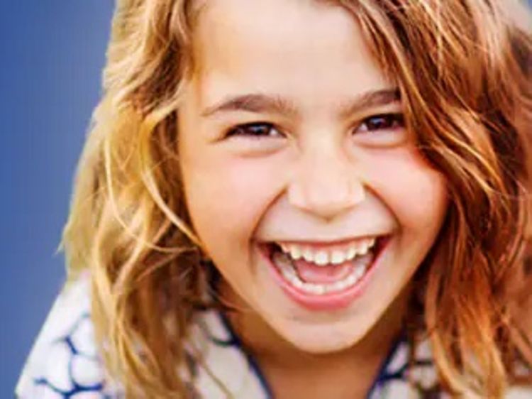 Oral-B Kids mest brukte merke-logo med en smilende jente