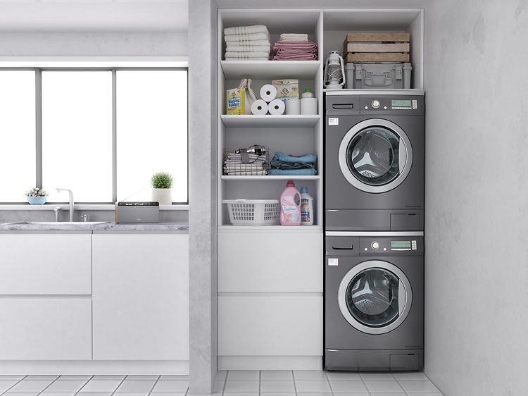 Washer and dryer stacked in a laundry room