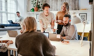 A small group of people in a meeting