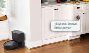 iRobot på kjøkken med en snakkeboble med norsk tekst