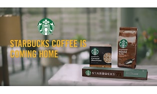 Forskjellige Starbucks produkter til hjemmebruk med teksten "Starbucks coffee is coming home" 