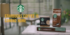 Forskjellige Starbucks produkter til hjemmebruk med teksten "Starbucks coffee is coming home" 