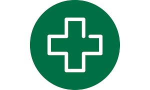 hvitt førstehjelpssymbol på en rund og grønn bakgrunn