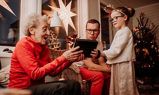 Christmas-Grandmother opening gift