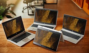 Fire HP EliteBook bærbare PC-er på et bord