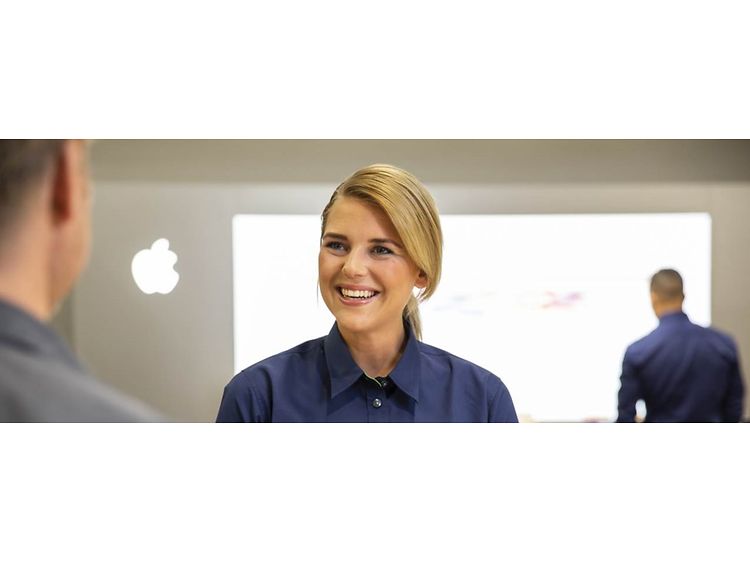 Elkjøp-selger, kunde og Apple-logo
