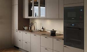 Sand EPOQ Trend kjøkken med integrert kjøkken og brun kjøkkenbenk, integrert kokeplate og vask
