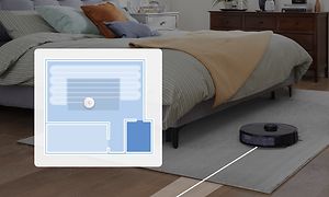 Kart som viser deler av området som kan bli støvsuget og en Roborock S6 MaxV Vacuum i bakgrunnen