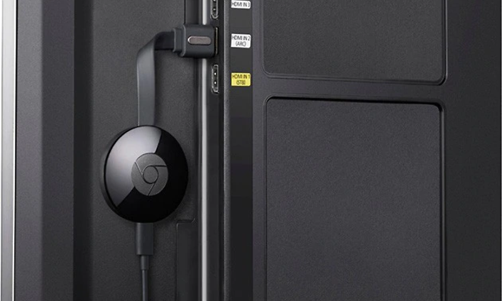 chromecast plugged in to the back of the TV