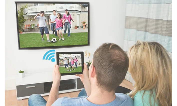 Couple using chromecast from a tablet