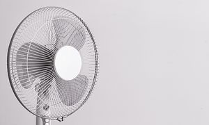 The head of a cooling fan on grey background