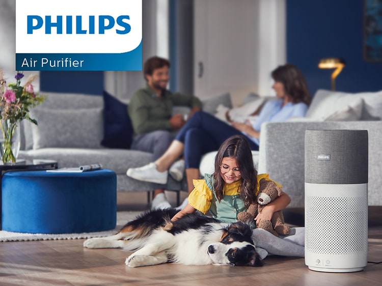 Philips air luftrenser ved siden av et barn og en hund
