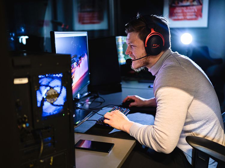 Man playing on a desktop gaming pc