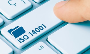 A finger pressing a key on a keyboard with a file symbol and the text ISO 14001