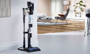 Philips AquaTrio vacuum attached to storage station