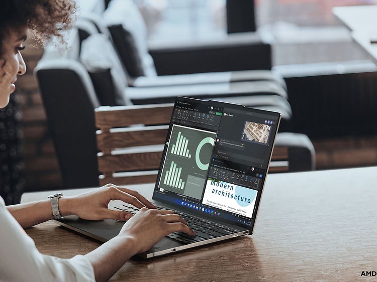 Lenovo bærbar PC og en kvinne som bruker den