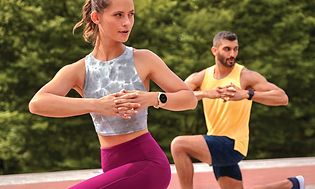 Garmin Venu 2 Plus on a woman and a man doing yoga