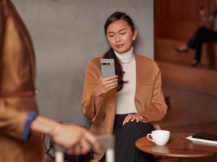 Woman looking at Pixel phone