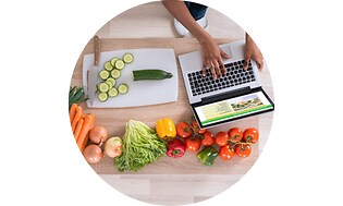 CS -Support- Laptop on a table with vegetables