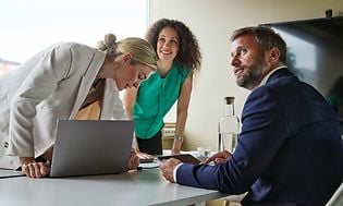 B2B - Two women and a man in a meeting room