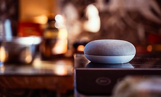 Google Home Mini/Nest placed on a shelf - blurry background