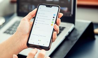 Google - Google Assistant - Woman uses google assistant on smartphone