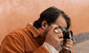 Man with Pixel Buds photographing