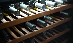 Wine bottles on wooden shelves