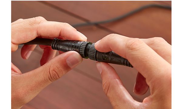 Hands adjusting cable