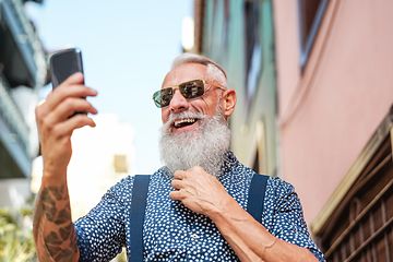 Older man looking at mobile