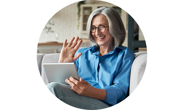 Older woman waving at pad