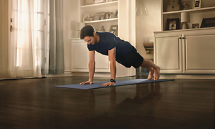 Man doing push-ups with garmin-venu-2