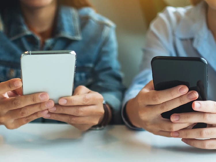 three-teenagers-using-their-smartphone