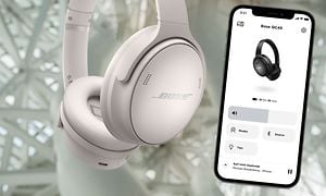 Hvite Bose-hodetelefoner og iPhone med Bose Music-app