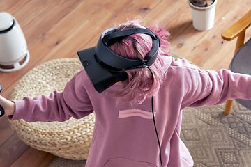 Woman-VR-gaming-in-a-living-room