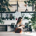 B2B - Indoor climate - Woman working at an office surrounded by plants