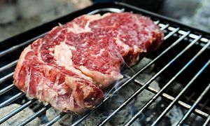 raw meat on grill