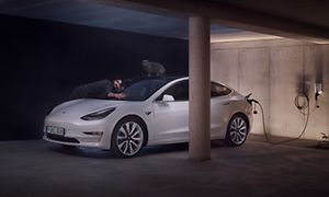 Brown-Tibber- electric car in carport