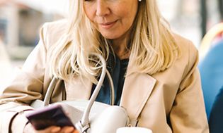 Woman looking at phone on public transport