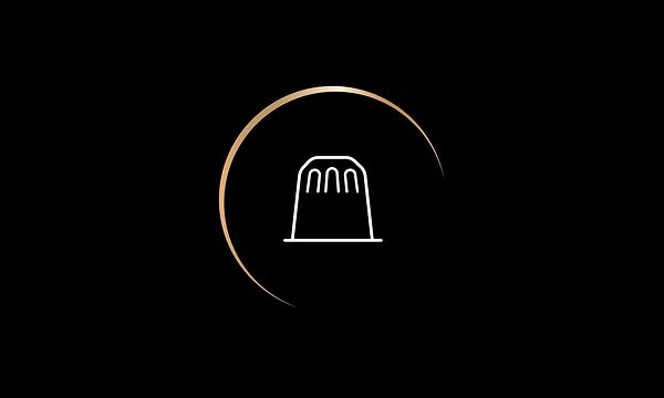 LOR-ikon som viser Nespresso-kompatibel kaffekapsel på svart bakgrunn