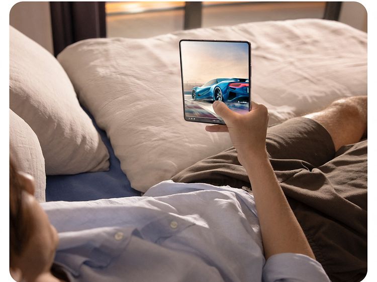 Man watching movie on Samsung ZFold5 phone