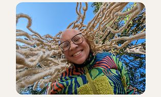 Woman with dreadlocks smiling